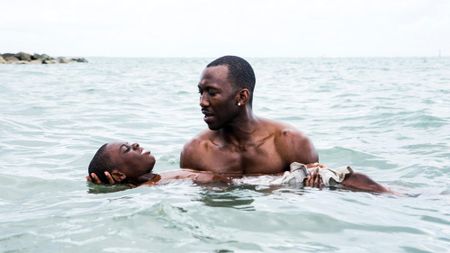 Alex Hibbert and Mahershala Ali in the ocean in Moonlight