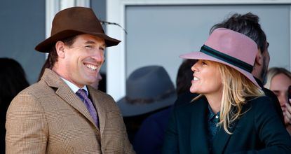 Peter Phillips and Autumn Phillips watch the racing as they attend day four 'Gold Cup Day' of the Cheltenham Festival 2020 at Cheltenham Racecourse on March 13, 2020 in Cheltenham, England.