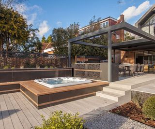 outdoor living space with hot tub