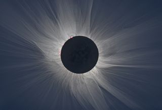 The jets and streamers present in the sun's corona become visible to the human eye during a total solar eclipse. These features are not typically visible in photographs of a total solar eclipse; this composite image makes them visible.