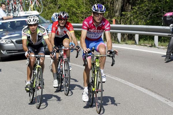 Fabio Duarte, Domenico Pozzovivo (obscured), Tiago Machado and Michele Scarponi (l-r) climb to the finish.