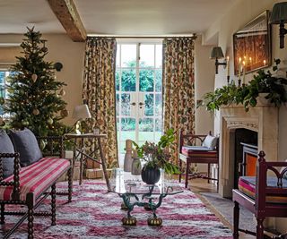 christmas decorated living room with fireplace and christmas tree