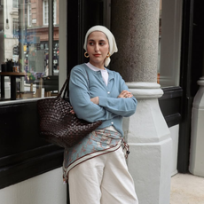 Modest Mira wearing an expensive looking brown bag