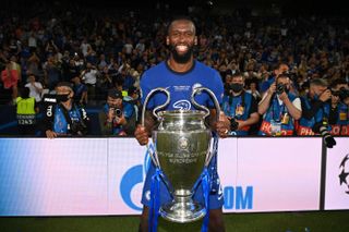 Antonio Rudiger poses with the Champions League trophy after Chelsea's win over Manchester City in the 2021 final in Porto.