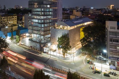 MAP Museum of Art and Photography Bangalore nighttime hero exterior