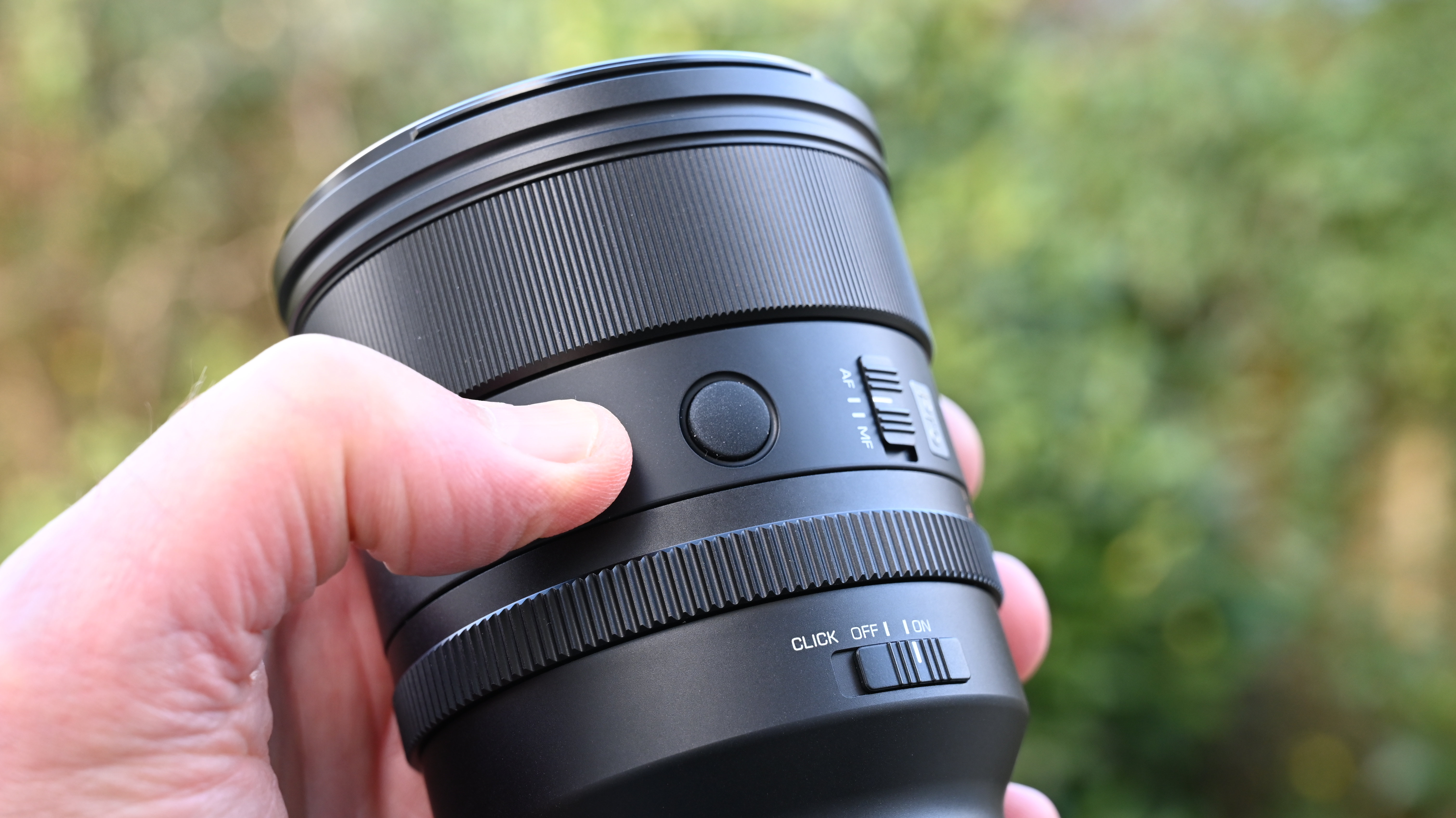 Viltrox AF 85mm f/1.4 Pro product shot, lens in hand