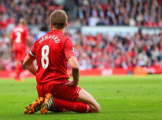 Liverpool midfielder Steven Gerrard on his knees during the Reds' Premier League game against Chelsea in April 2014.
