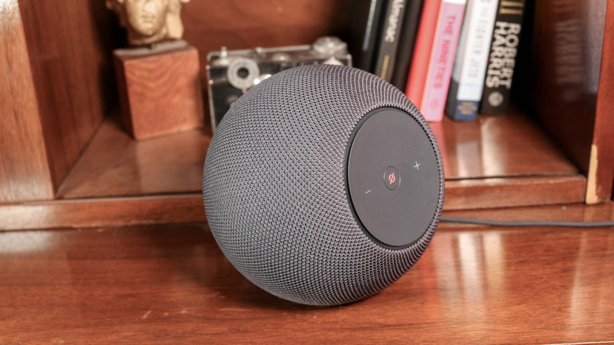 Amazon Echo Studio on a book shelf