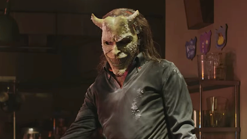 The Grabber standing in camp building with Gwen in Black Phone 2