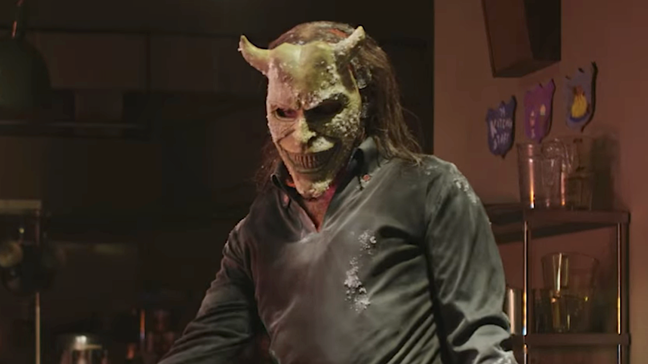 The Grabber standing in camp building with Gwen in Black Phone 2