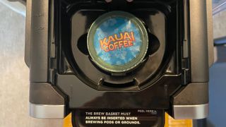 A close up of a coffee pod in the Ninja DualBrew Pro coffee maker