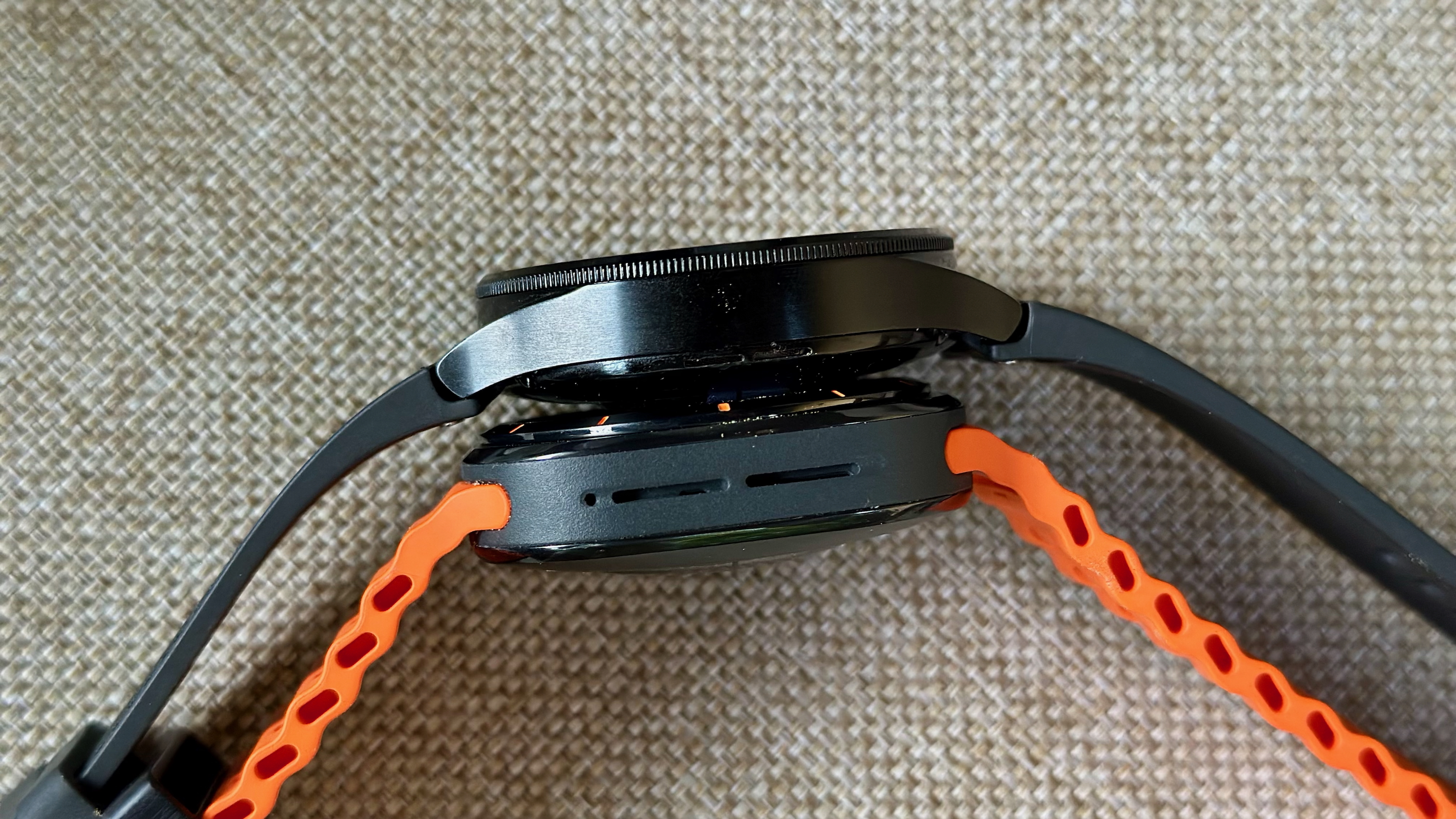 The Samsung Galaxy Watch 6 Classic (top) and Galaxy Watch Ultra (bottom) sitting next to each other.