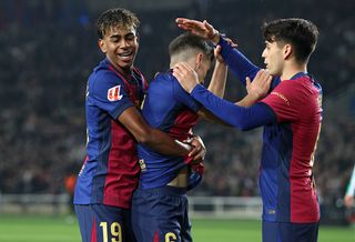 BARCELONA, SPAIN - APRIL 05: Gavi of FC Barcelona celebrates scoring his team's first goal with Hansi Flick, Head Coach of FC Barcelona, during the LaLiga match between FC Barcelona and Real Betis Balompie at Estadi Olimpic Lluis Companys on April 05, 2025 in Barcelona, Spain. (Photo by Judit Cartiel/Getty Images)