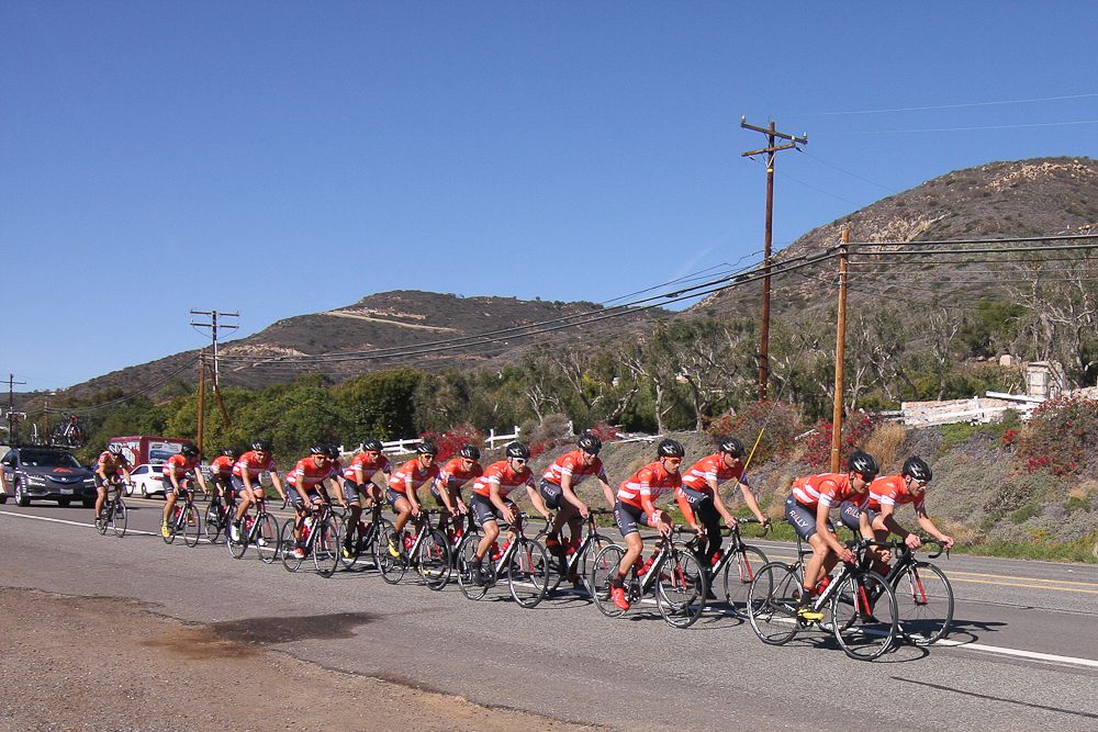 The Rally Cycling team in formation near Malibu Beach.