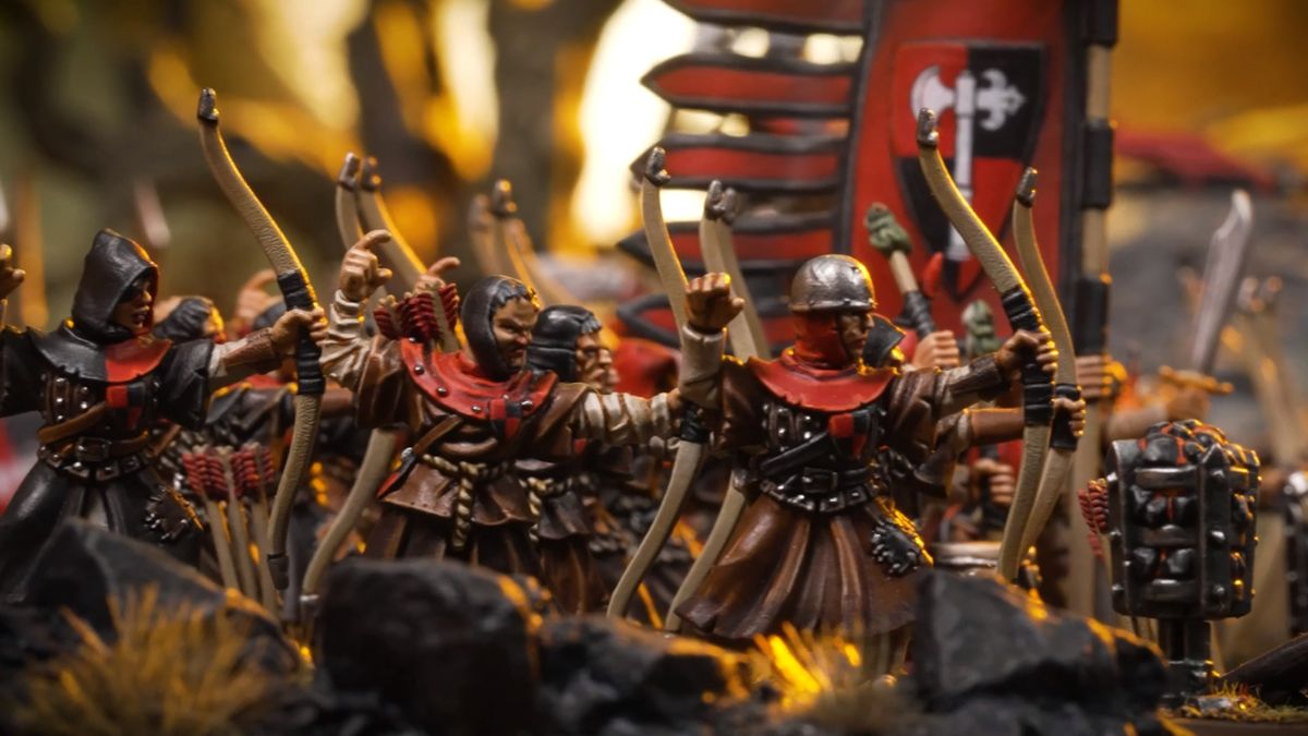 Bowmen fire with a Bretonnian flag beside them