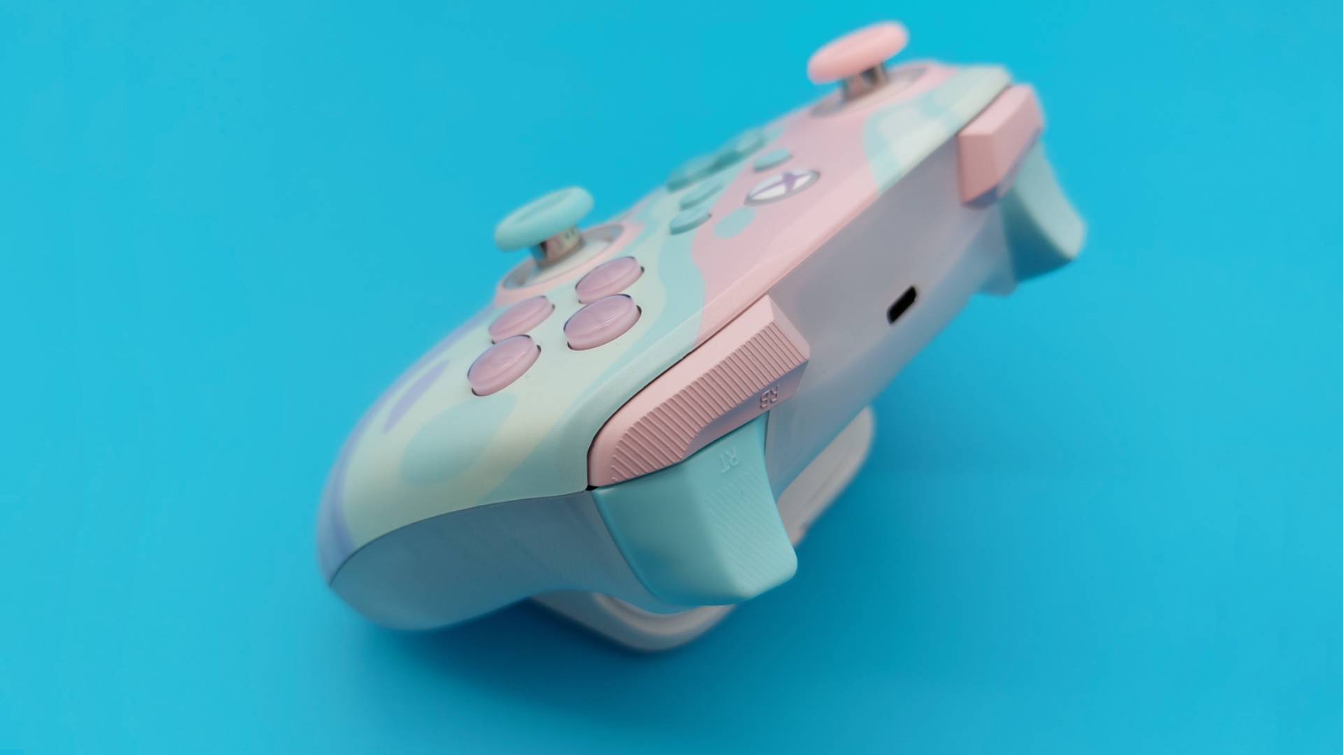 The GameSir T7 Pro Sugar Whirl Wireless Controller seen from various angles.