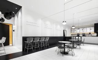 The restaurant with a monochromatic palette of white and black.