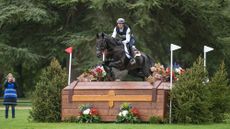 Germany's J&eacute;r&ocirc;me Robin&eacute; and Black Ice clear a large wooden chest at the Blenheim European Eventing Championships 2025.