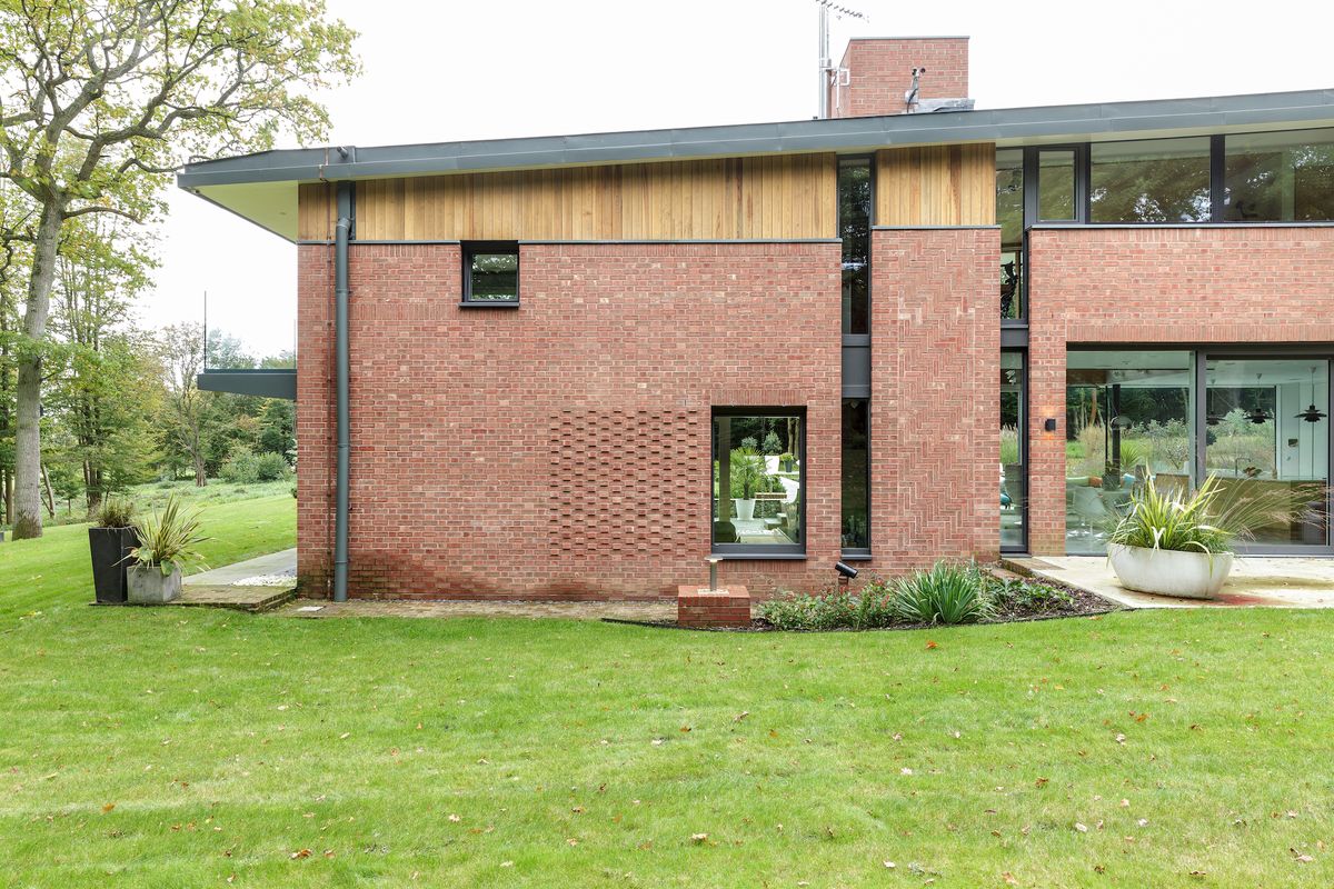 red brick details on front of self build