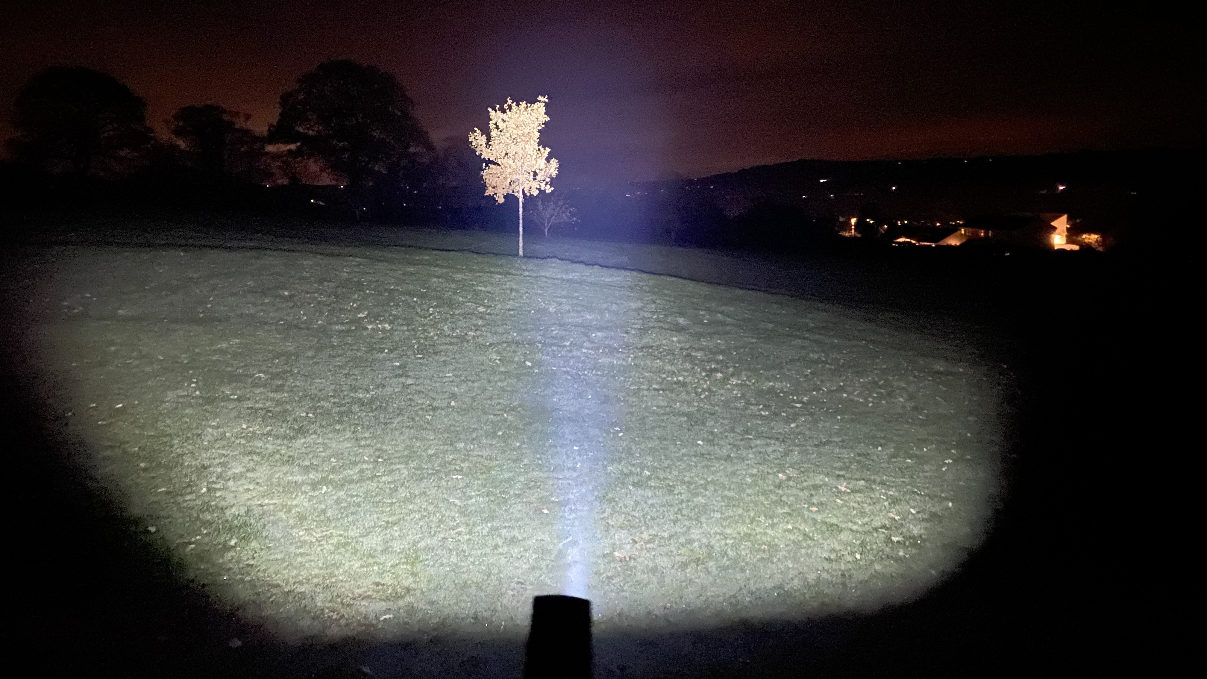 The Olight ArkPro in use on a dark night