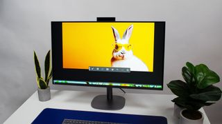 HP OmniStudio X 31.5 all-in-one PC with display showcasing a white rabbit wearing yellow sunglasses