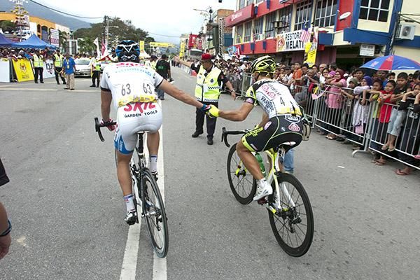 Two riders who know where the presentations are: Skil Shimano sprinter and 2010 Tour of Hainan multiple stage winner, Kenny Van Hummel (left), shows 2011 Tour de Langkawi multiple stage winner, Andrea Guardini (Farnese Vini/Neri Sottoli), the way to the presentations.