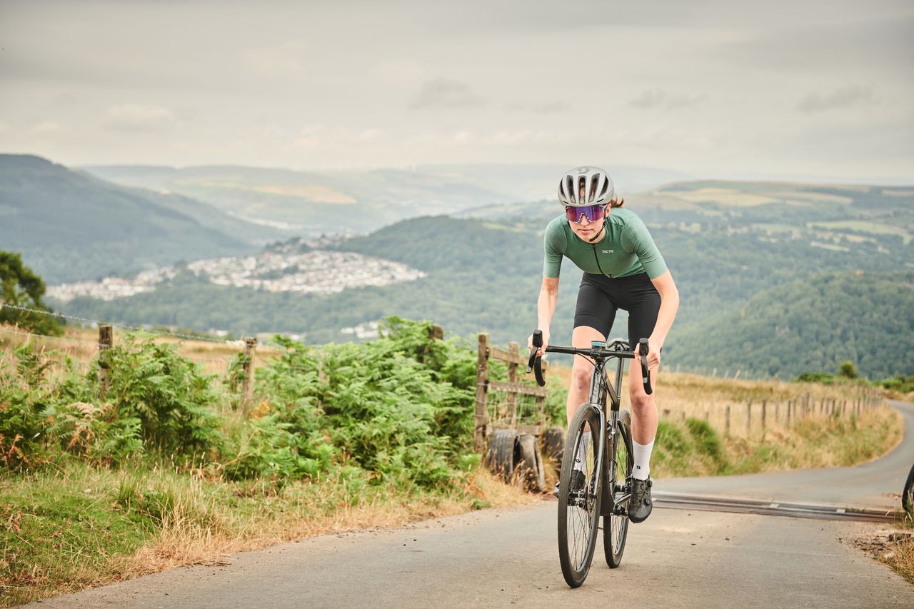 Image shows a rider climbing out the saddle.