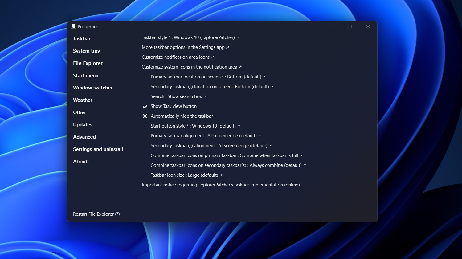 ExplorerPatcher app open on a Windows 11 desktop with blue background.