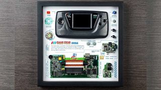 A framed deconstructed Sega Game Gear