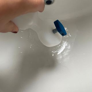 Pouring water from radiator bleed tool down the sink