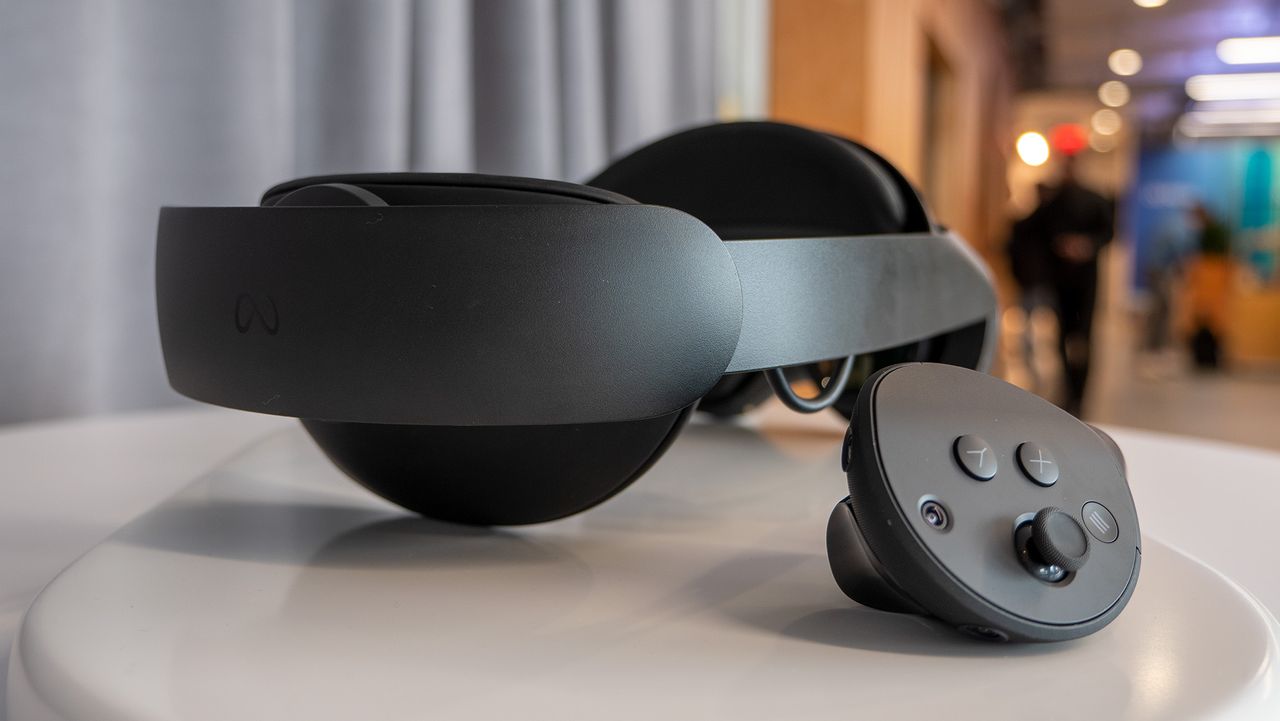 The head strap of the Meta Quest Pro next to a Quest Touch Pro controller