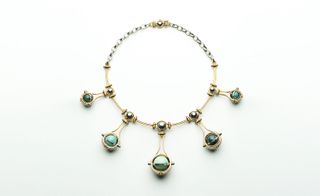 Top worked with kinetic metal spheres that concealed or revealed his precious stone globes inside.