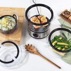 Salter 3 Tier Electric Food Steamer with tiers cooking vegetables, rice and salmon