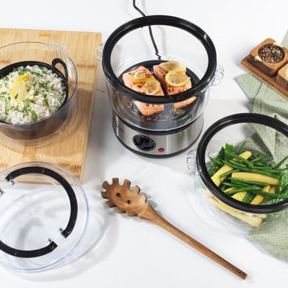 Salter 3 Tier Electric Food Steamer with tiers cooking vegetables, rice and salmon
