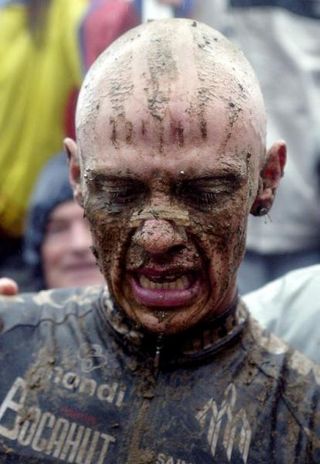 John Gadret covered head to toe in mud.