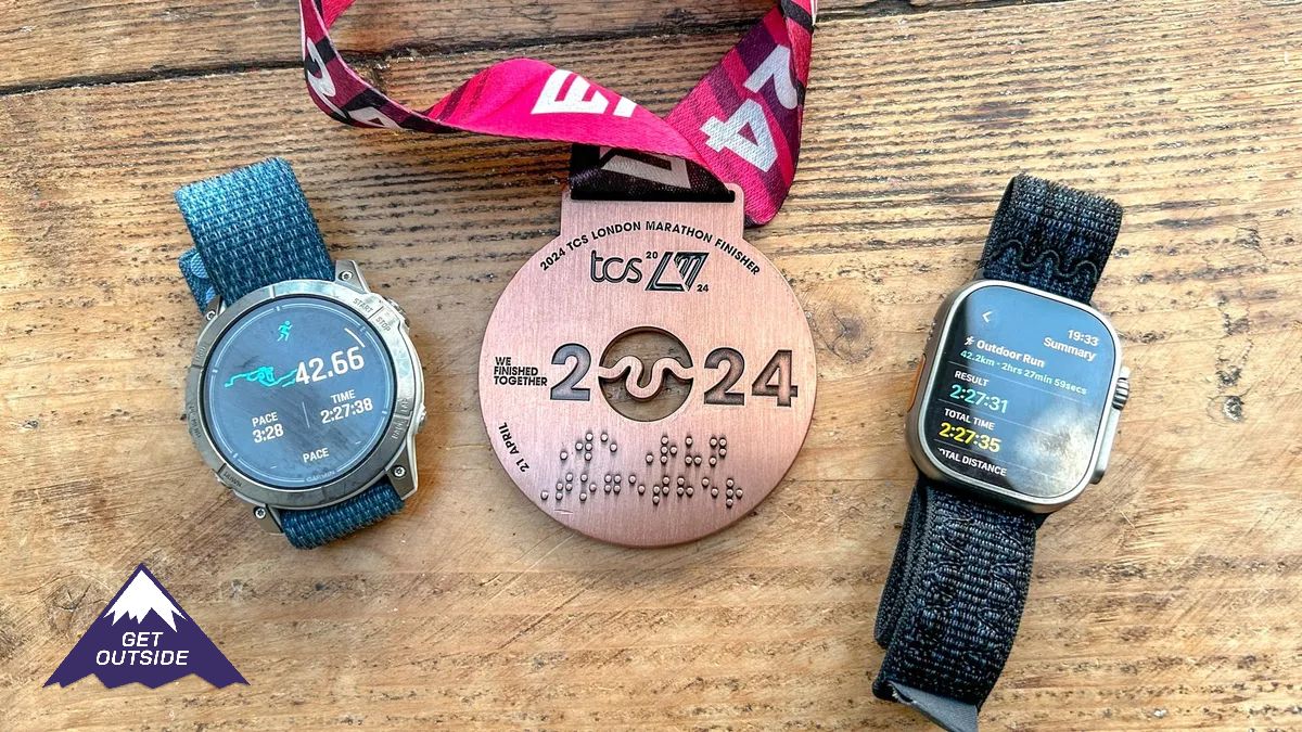 Apple Watch Ultra and Garmin Epix pro with a london marathon medal