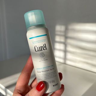 Laura holding Curél Deep Moisture Spray