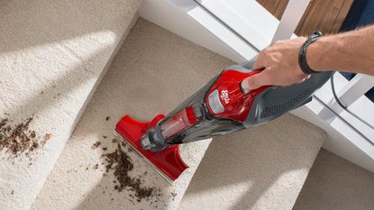 Image of Dirt Devil Scorpion + Hand Vacuum in promo lifestyle image being used on staircase