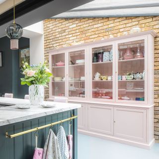 kitchen with pink storage shelves