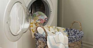 Picture of assorted clothes and fabrics in a washing machine drum