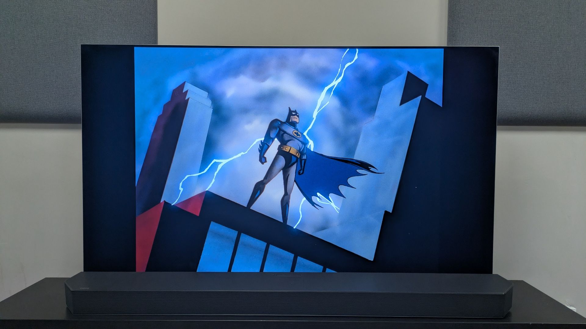 Batman THe Animated Series showing shot of Batman on rooftop in front of lightning strike