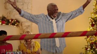 Morgan Freeman throwing his hands up in celebration in Just Getting Started.