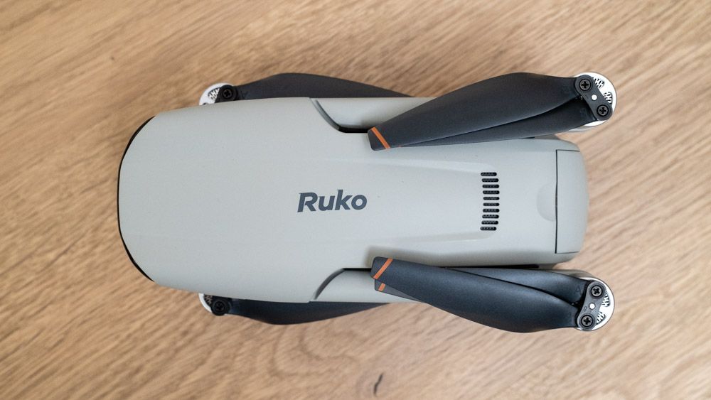 Ruko F11PRO 2 drone folded on a wooden surface