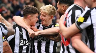 Lewis Miley is congratulated by Anthony Gordon after scoring for Newcastle against Fulham in December 2023.