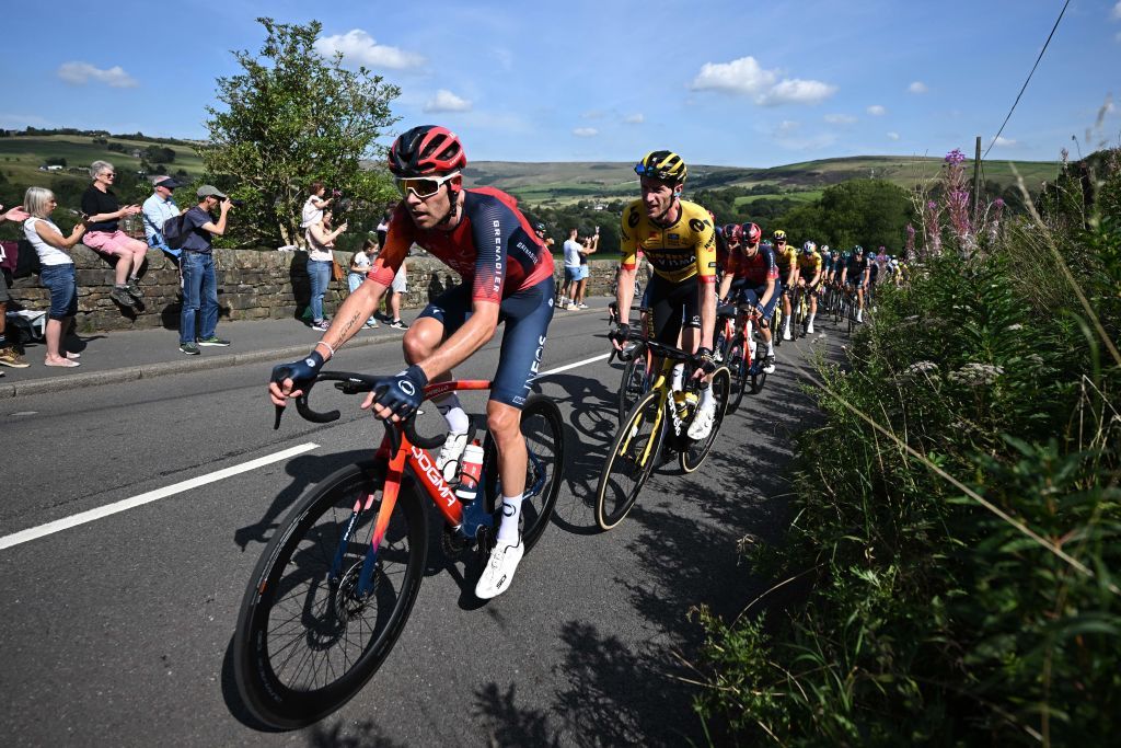 Luke Rowe (Ineos Grenadiers) sets the pace at the front of the peloton