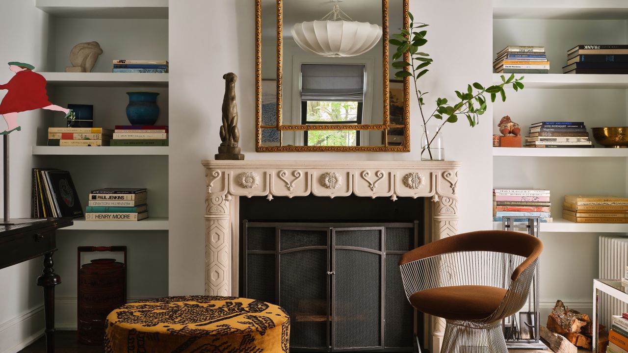 living room with modern chair and ornate fireplace