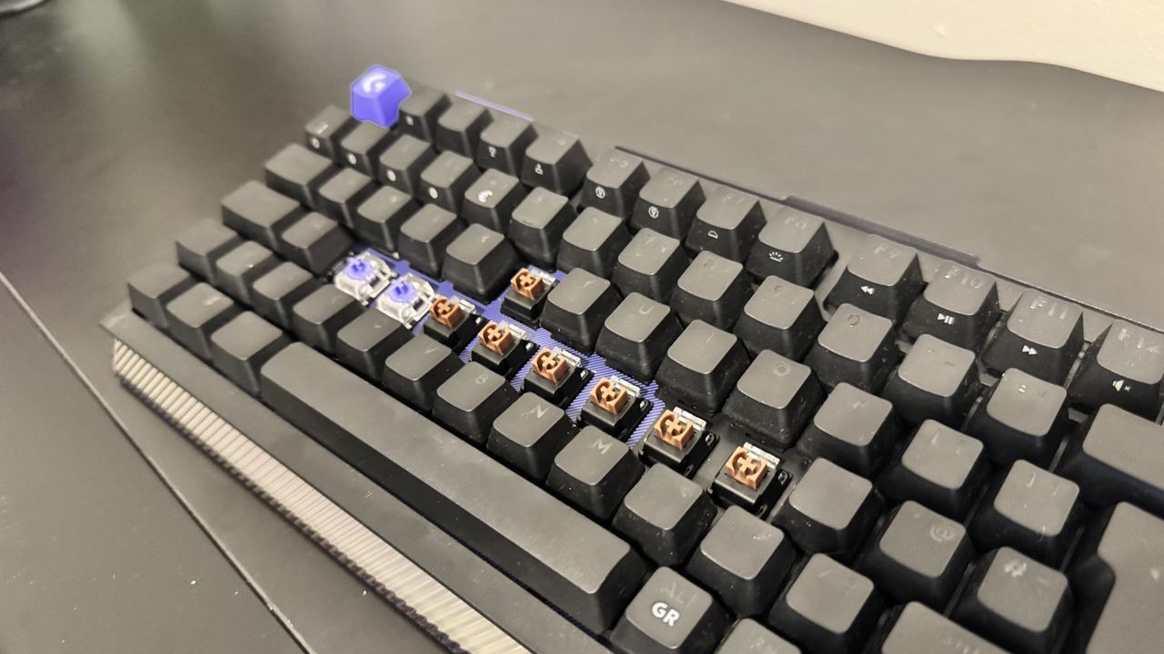 The Logitech G512 X gaming keyboard from the side, showing off the switch beds