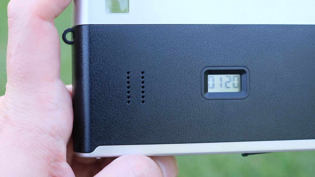 Photograph of Camp Snap CS-Pro digital compact camera with close view of speaker holes