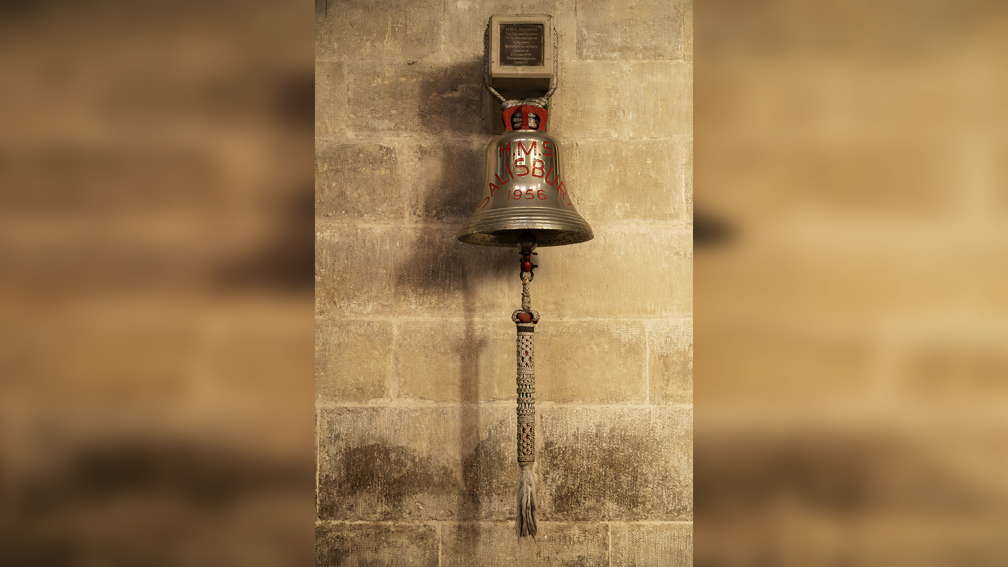 A ship&#039;s bell hangs on the wall