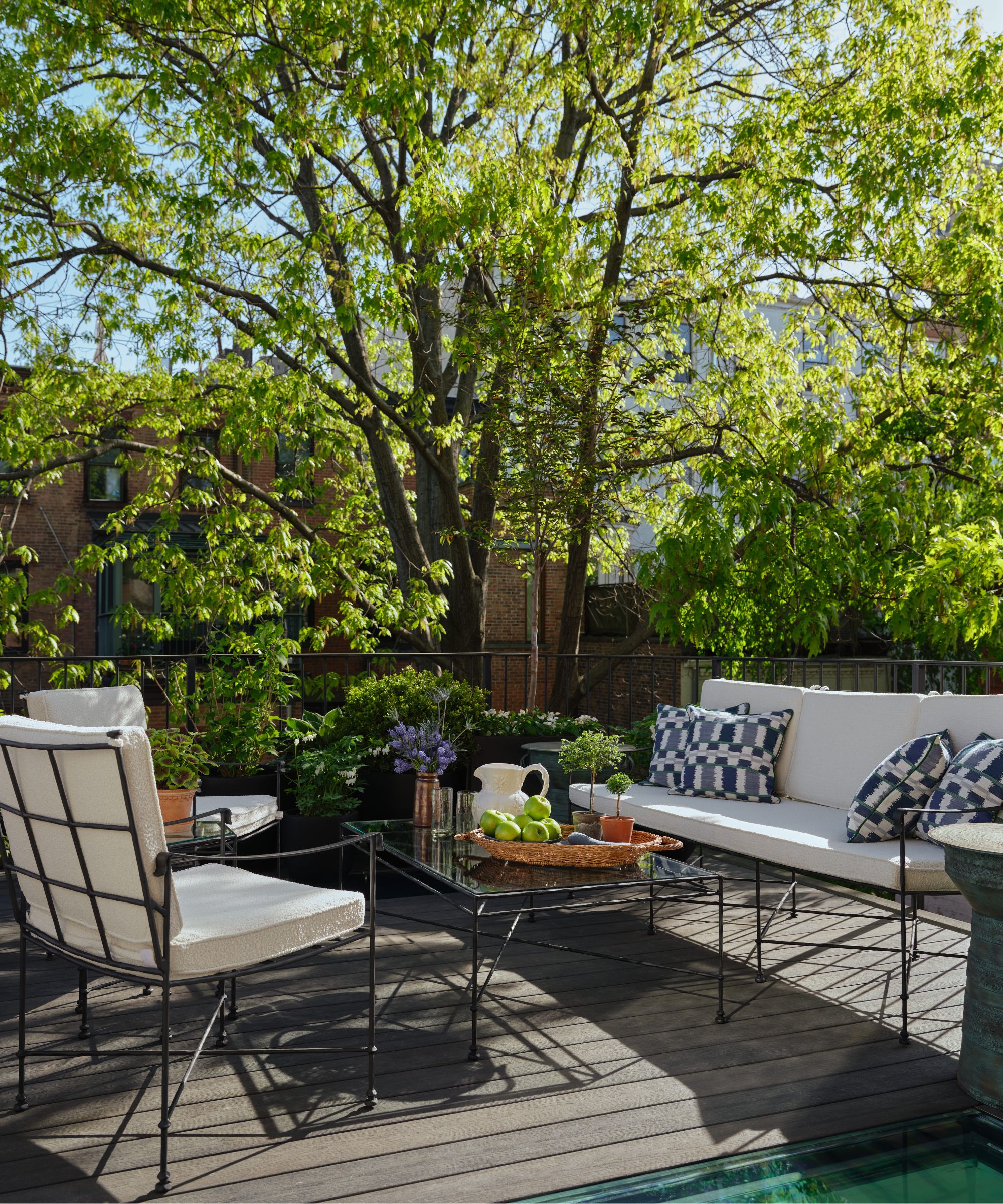a patio area in new york off of a primary bedroom with wrought iron seating